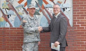 Lt. Col Andrew Batten of the South Carolina National Guard and Williamston Mayor Mack Durham shake hands following a ceremony in which the SCNG turned ownership of the local Armory to the Town of Williamston.